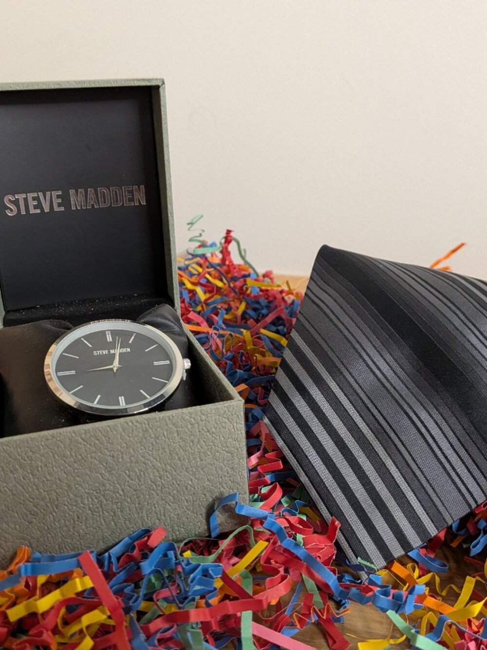 Men's grey stripped tie and watch.
